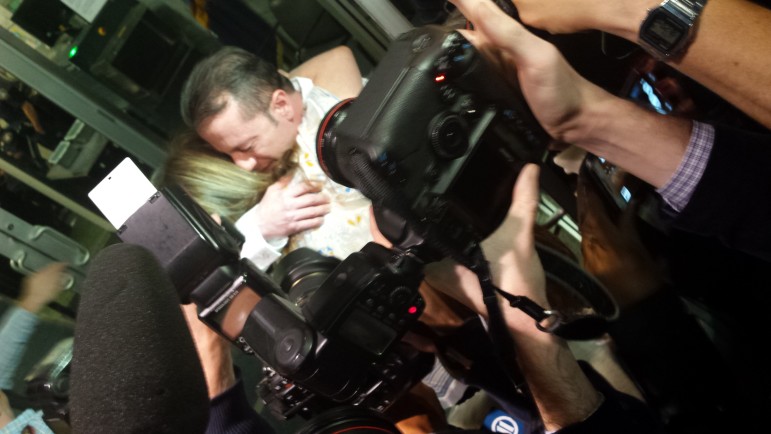 Johnny Hincapie embraces his mother as he leaves the courthouse after getting his conviction overturned on October 6. 