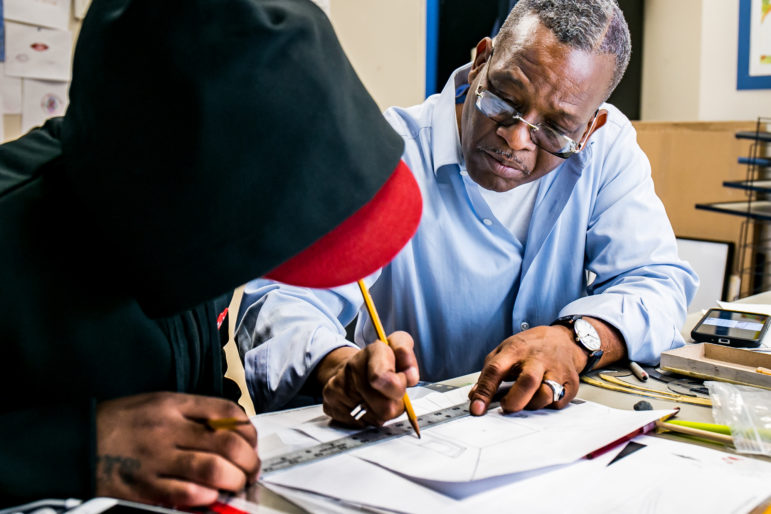 On a recent Thursday, Guy Woodard teaching a client single perspective drawing during an art class at the Fortune Society's Long Island City location. Woodard got out of prison in July 2015. He began teaching art a month later.