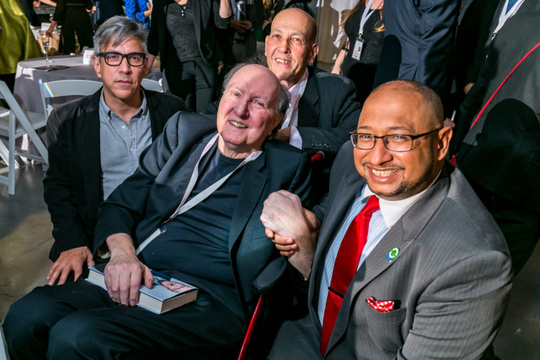 Honorees Barrett and Garrido (at right) joined by Eddie Borges (in glasses) and Fred Smith.