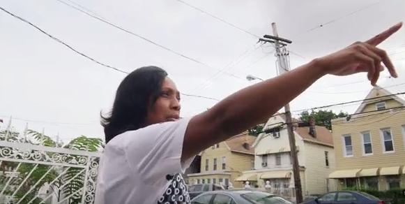 Ramarley Graham’s mother, Constance Malcolm, points out where her son was walking before police, coming from a different direction, stormed her house and killed him.