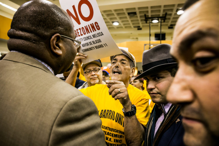 Roberto Anazagasti, one of the leaders of El Barrio Unite, talking with representatives of the Council speaker and Manhattan Borough President.