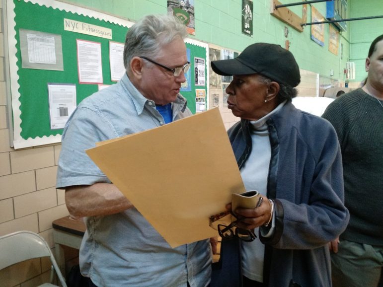 Voters approached Humphrey Ortiz, 63, the polling place coordinator at P.S. 8 Isaac Varian with a constant stream of questions about their ballots, including how to vote for their candidates, how to change their name on their voter registration, how to scan their ballots and more.