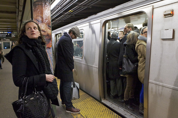 Commuters wait as the L-train arrives at the Bedford stop. A Brooklynite is 20 times more likely than the average American to take mass transit to get to work.