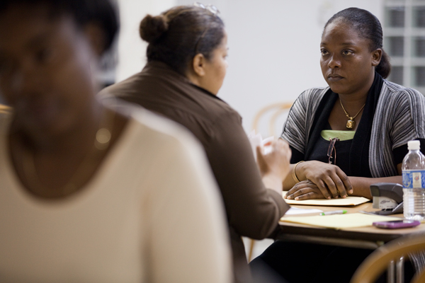 Guylene Clerger-Hyacinthe, who came to the U.S. in January because of the earthquake, gets help at the Haitian Family Resource Center on her filing for deferred action so that she may stay in the country.