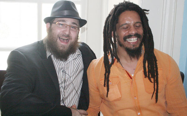 Hassidic Rapper DeScribe and Rohan Marley chat before a press conference premiering DeScribe's new song.