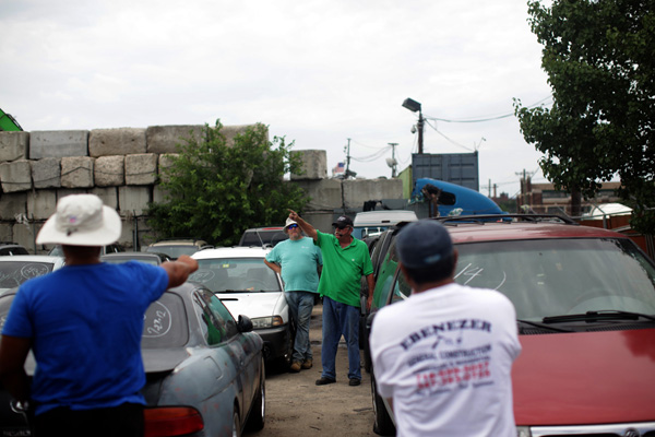 The auctioneer looks for a buyer. Any sudden movement can be considered a bid.