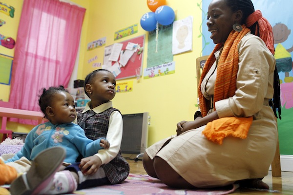 Cindy Vielle at the daycare she operates. Her hopes for the neighborhood revolve around reading: She'd love a new library and a bookstore.