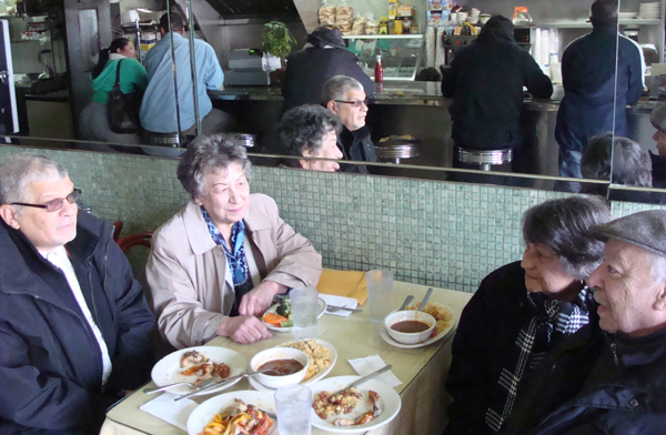 Clockwise from bottom left: Julio Rodriguez, Dr. Marian Rivas, Antonia Vega and Marcelo Sanchez, of the grassroots coalition We Are Mott Haven, discuss local issues at Camaguey Restaurant on March 24.