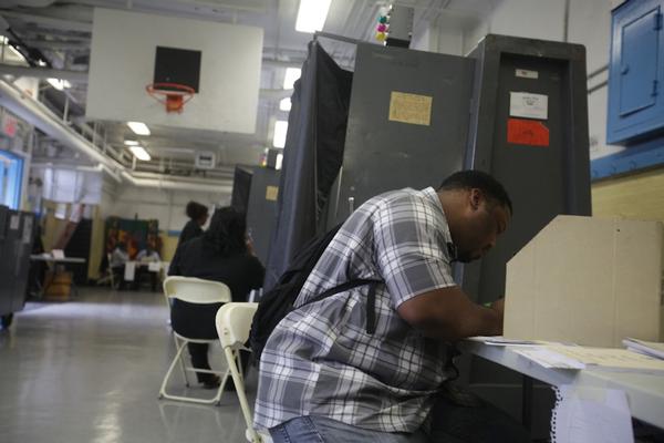 Wayne Jackson fills out an affidavit ballot at P.S. 44 in East Tremont. This year, his name was not on the voter registration though he has been voting at P.S. 44 for years.