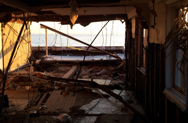 In Sea Gate, the ocean is visible through the ruins of several houses.