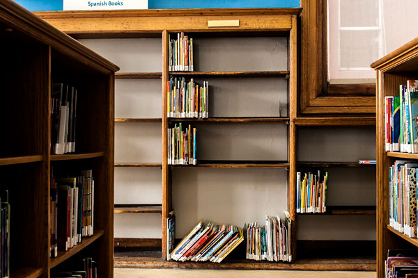 Nearly empty shelves at the Mott Haven branch in the Bronx. While patrons can order books from anywhere in the system, some users say they miss the ability to peruse the stacks.