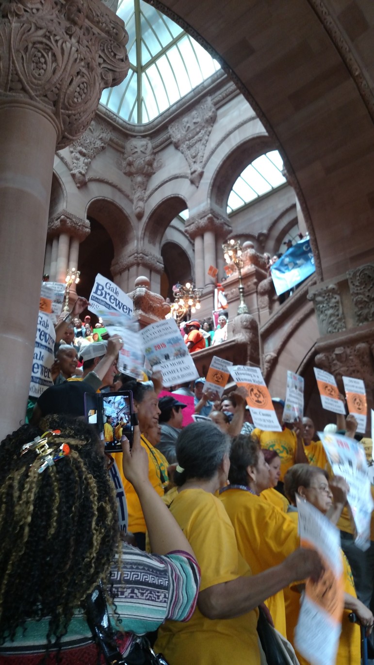 Tenants crowd the capitol stairs.