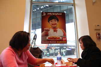 Helen Himbing, 58, (right) a home health aide who said she comes to Jollibee every day, and her friend enjoy a meal in New York City’s only Jollibee location in Woodside, Queens. 