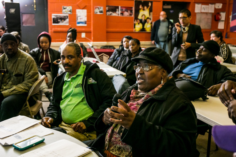 Lolita Miller, treasurer of the Tenants Association at Ocean Bay, asks a question at Tuesday's meeting on the RAD program soon to be implemented there.