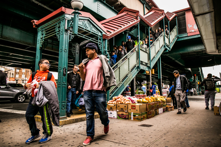 Passengers exit the 1 train at 207th Street and 10th Avenue.