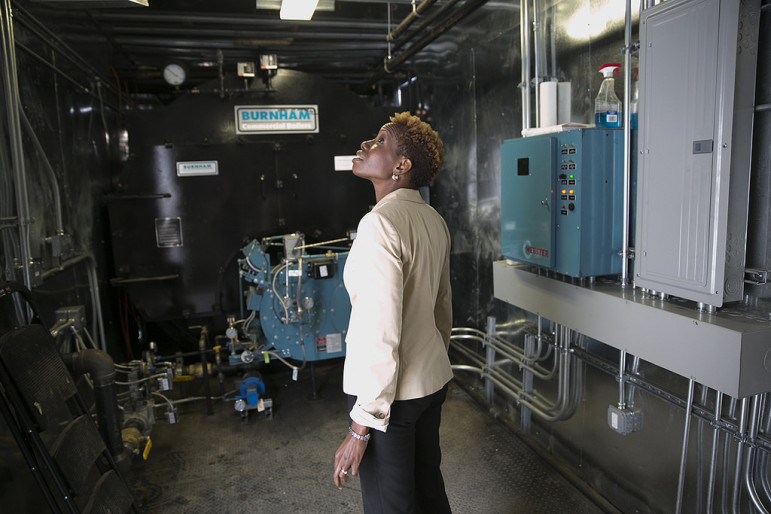 NYCHA chair Shola Olatoye inspects a NYCHA property in July. Olatoye inherited from her Bloomberg-administration predecessor a huge deficit in federal support and a substantial level of public mistrust. 