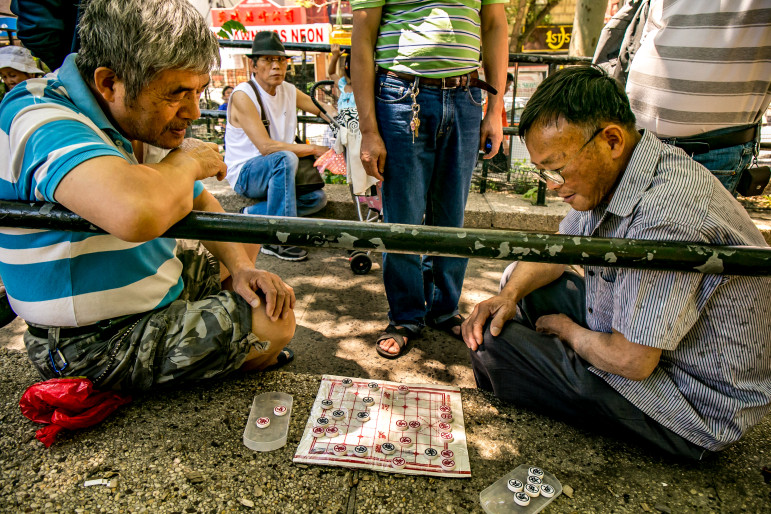 Older men pass a summer weekday in Sara D. Roosevelt Park in Chinatown. The large presence of immigrants in New York's senior population creates special vulnerabilities.