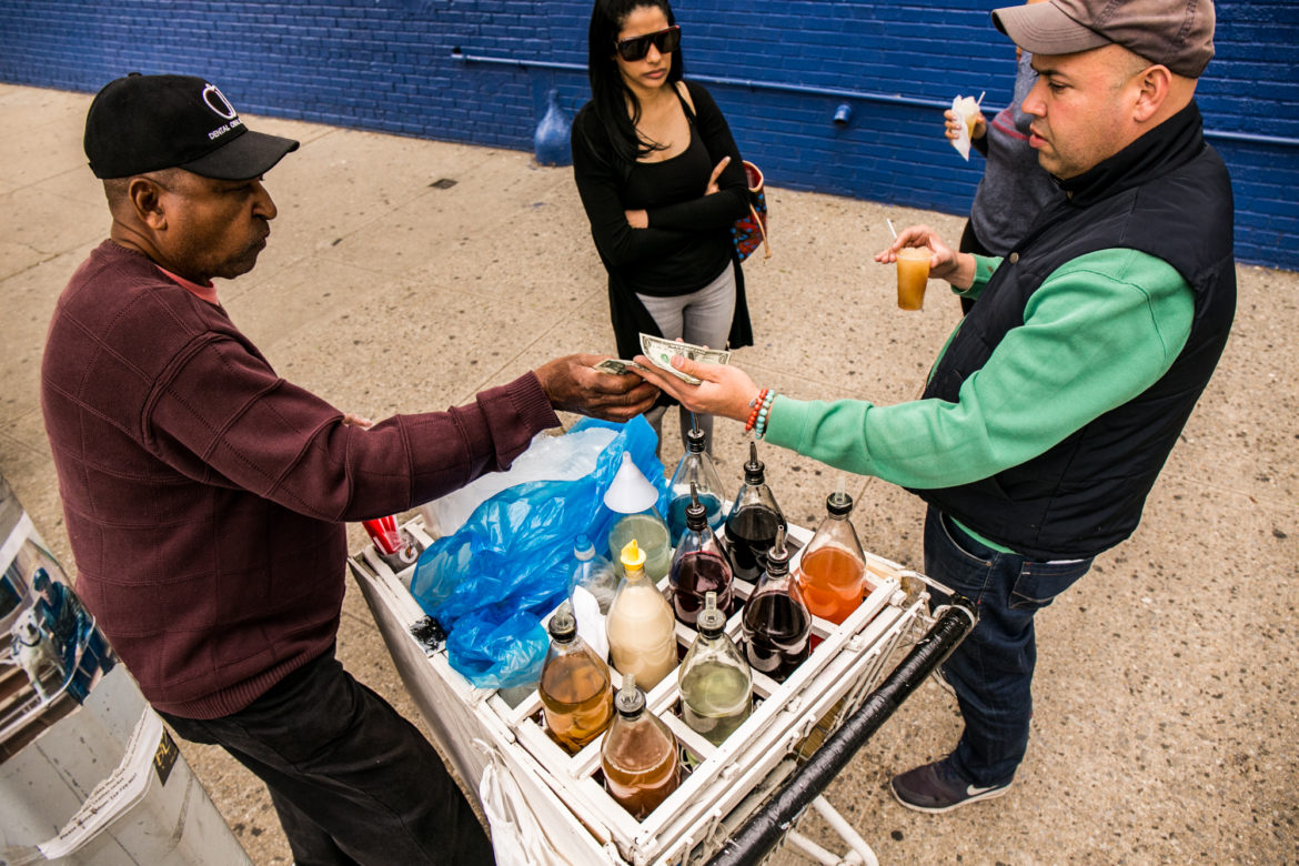 15-year Inwood resident and local restaurant owner David Oleaga enjoying some shaved ice with his friends on 9th avenue and 204 street.