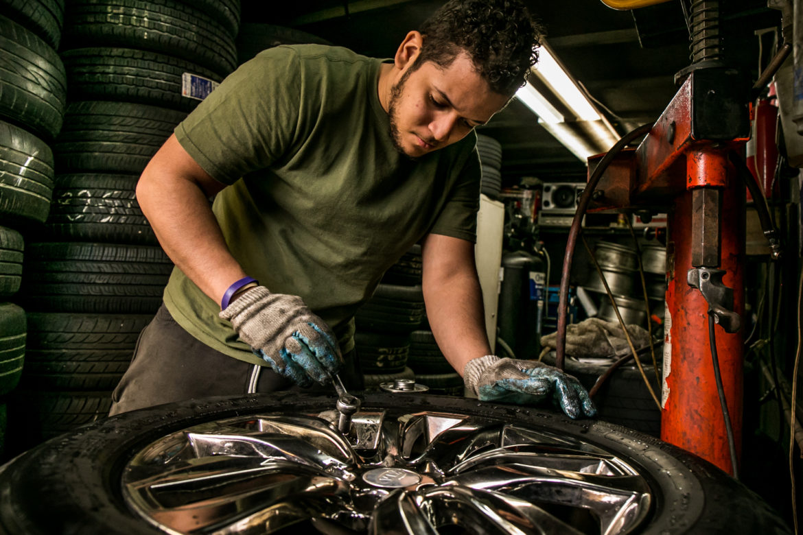 Melvin  has been working at his friend's tire repair shop for the last eight years, starting at age 13.