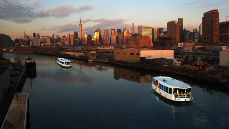 The winning concept at a recent Van Alen Institute charrette imagined moving commuters across underutilized infrastructure, combining ferry use across Newtown Creek with routing trains over an unused freight line.