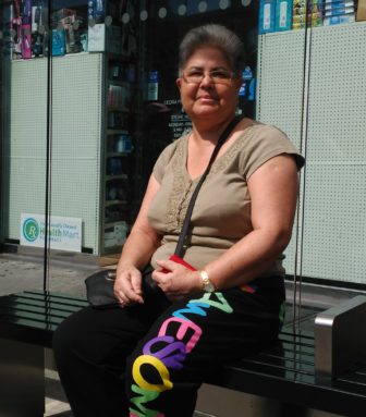 María Rodríguez, waiting for the Bx15 bus in the South Bronx, says that chemo treatments have prohibited her from taking the stairs into the subway. Instead she takes the bus, where she can board conveniently from the street. 