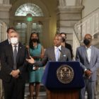 Mayor Eric Adams at a press conference podium in City Hall